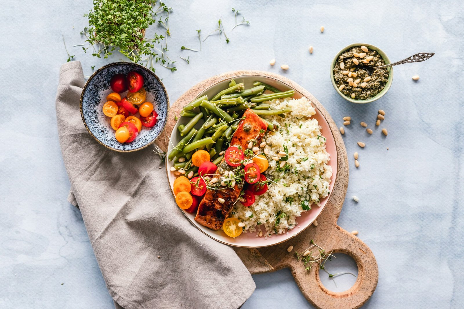 A person preparing a fresh, nutrient-dense meal as part of a daily sustainable lifestyle medicine routine.